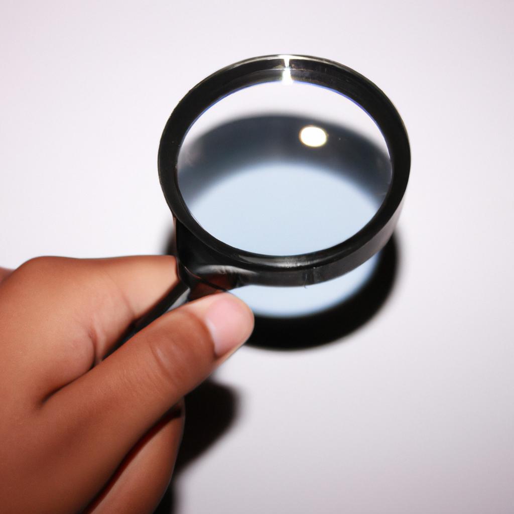 Person holding magnifying glass, investigating